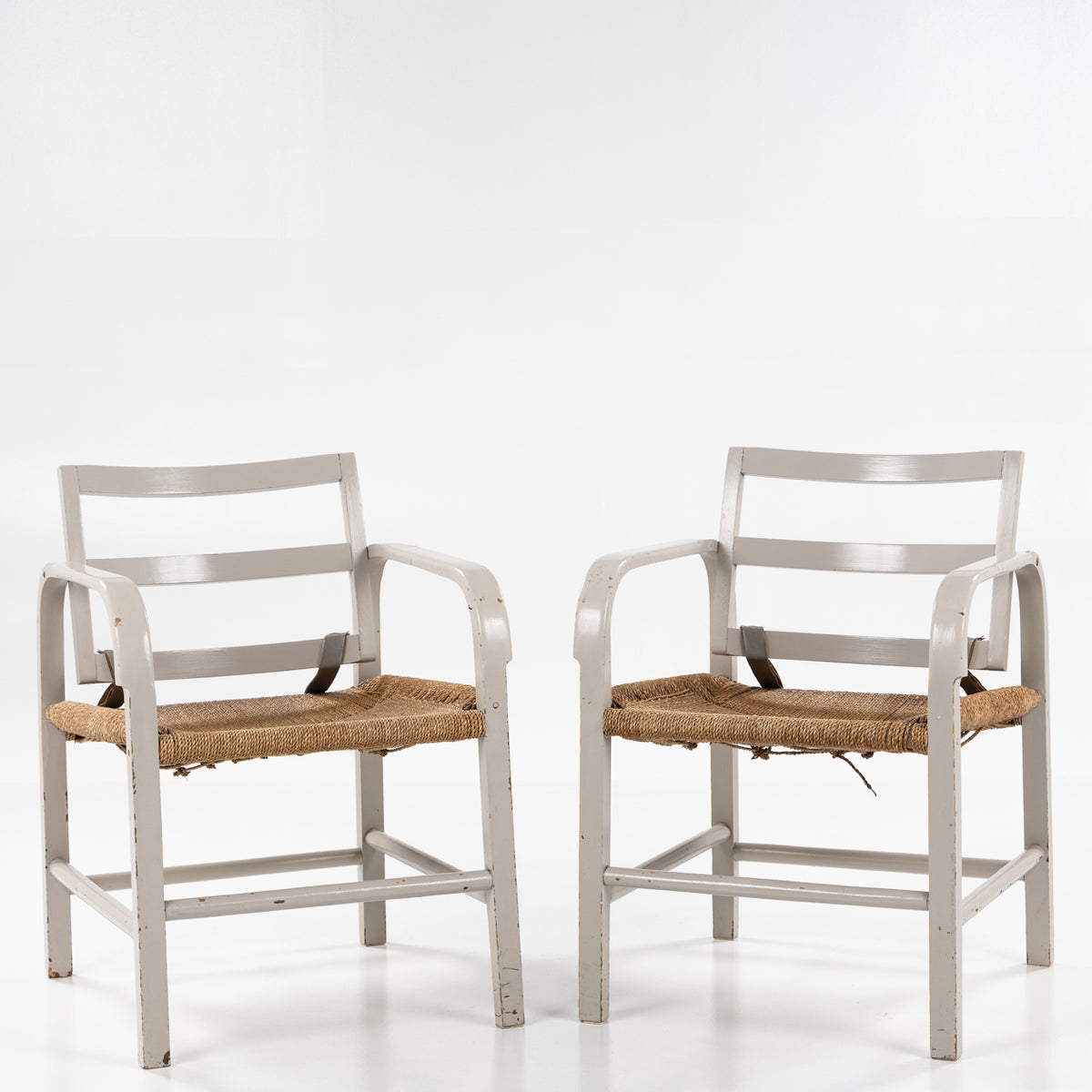 Pair of easy chairs in grey painted wood