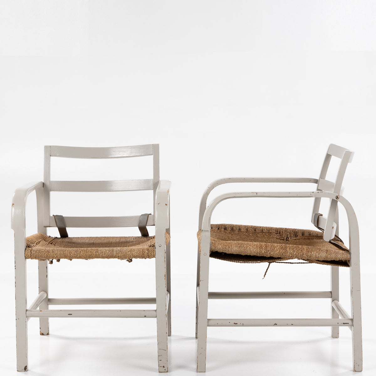 Pair of easy chairs in grey painted wood