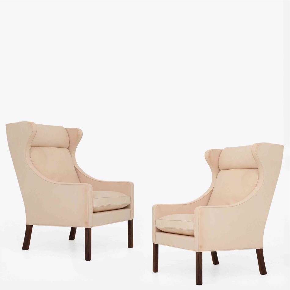 BM 2204 - A pair of Wingback Chairs in natural leather