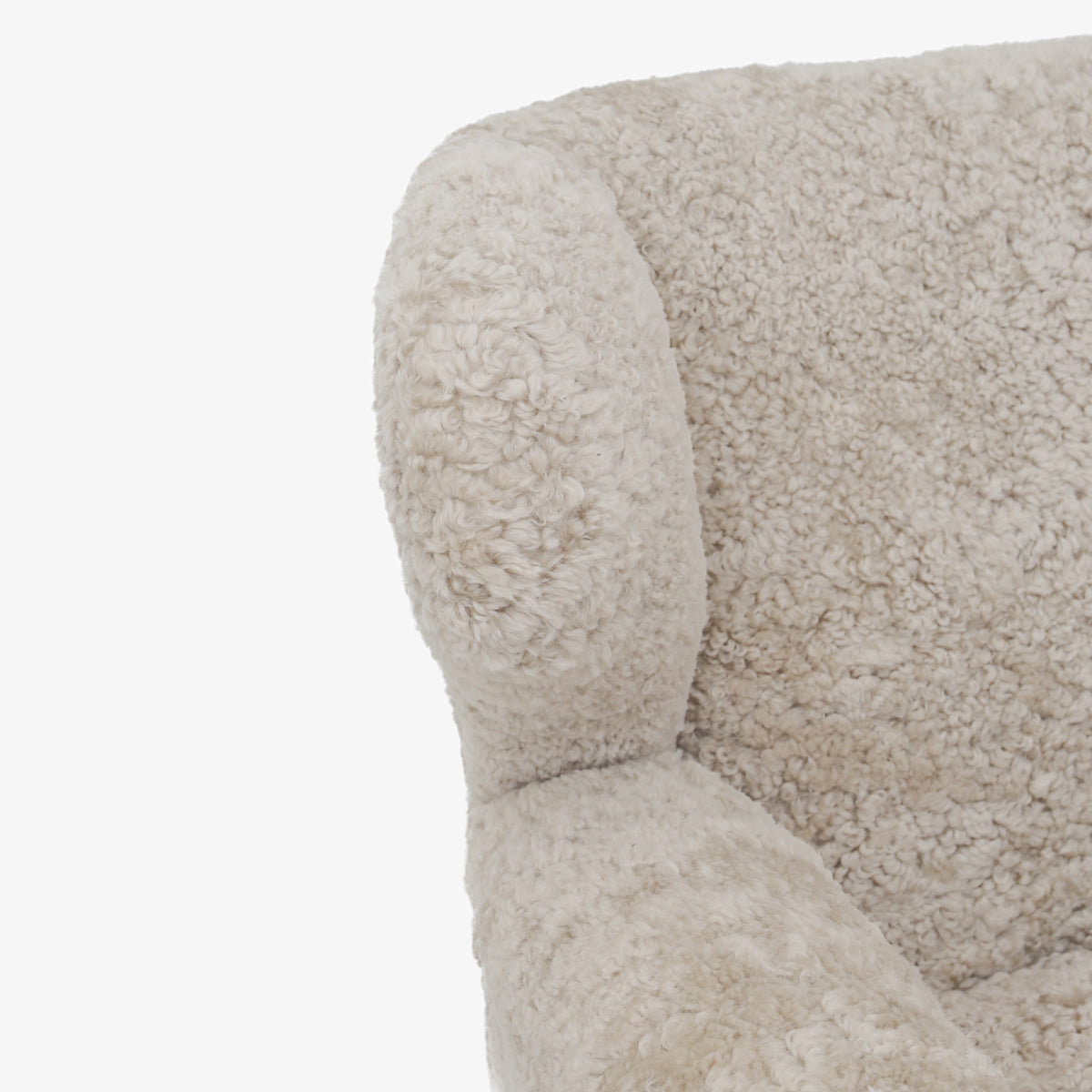 A pair of upholstered easy chairs in lambswool