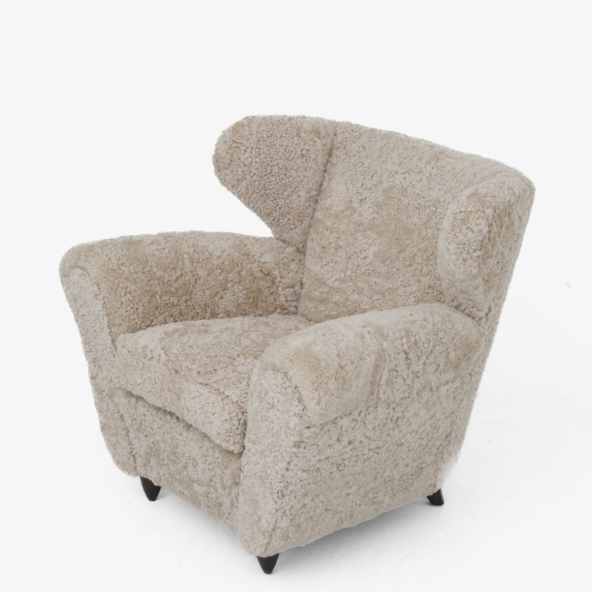 A pair of upholstered easy chairs in lambswool
