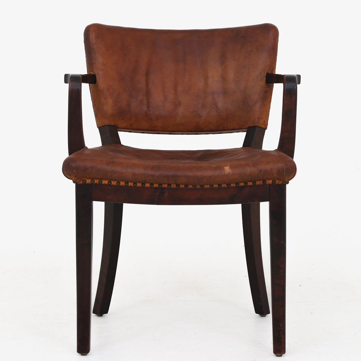 Armchair in patinated leather