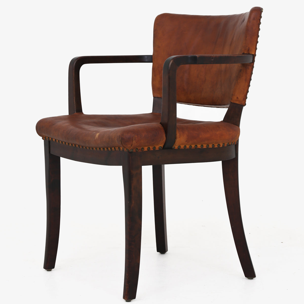 Armchair in patinated leather