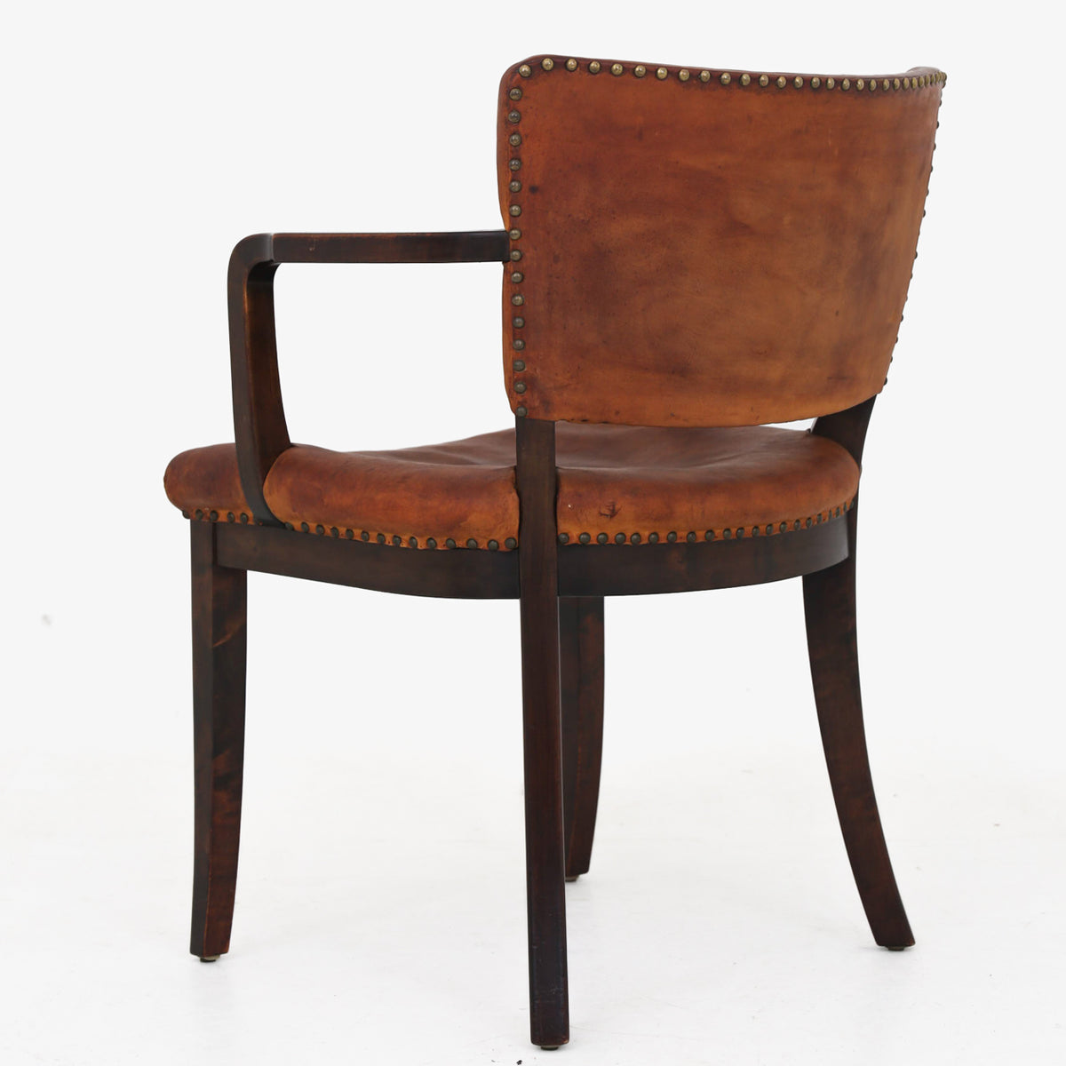 Armchair in patinated leather