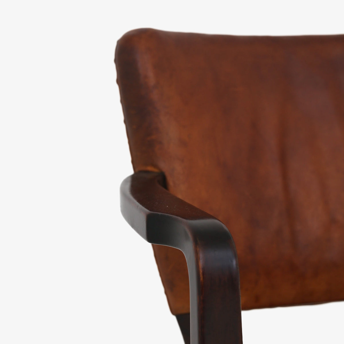 Armchair in patinated leather