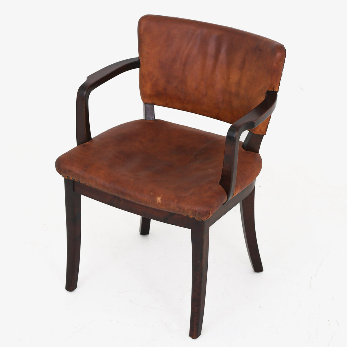 Armchair in patinated leather