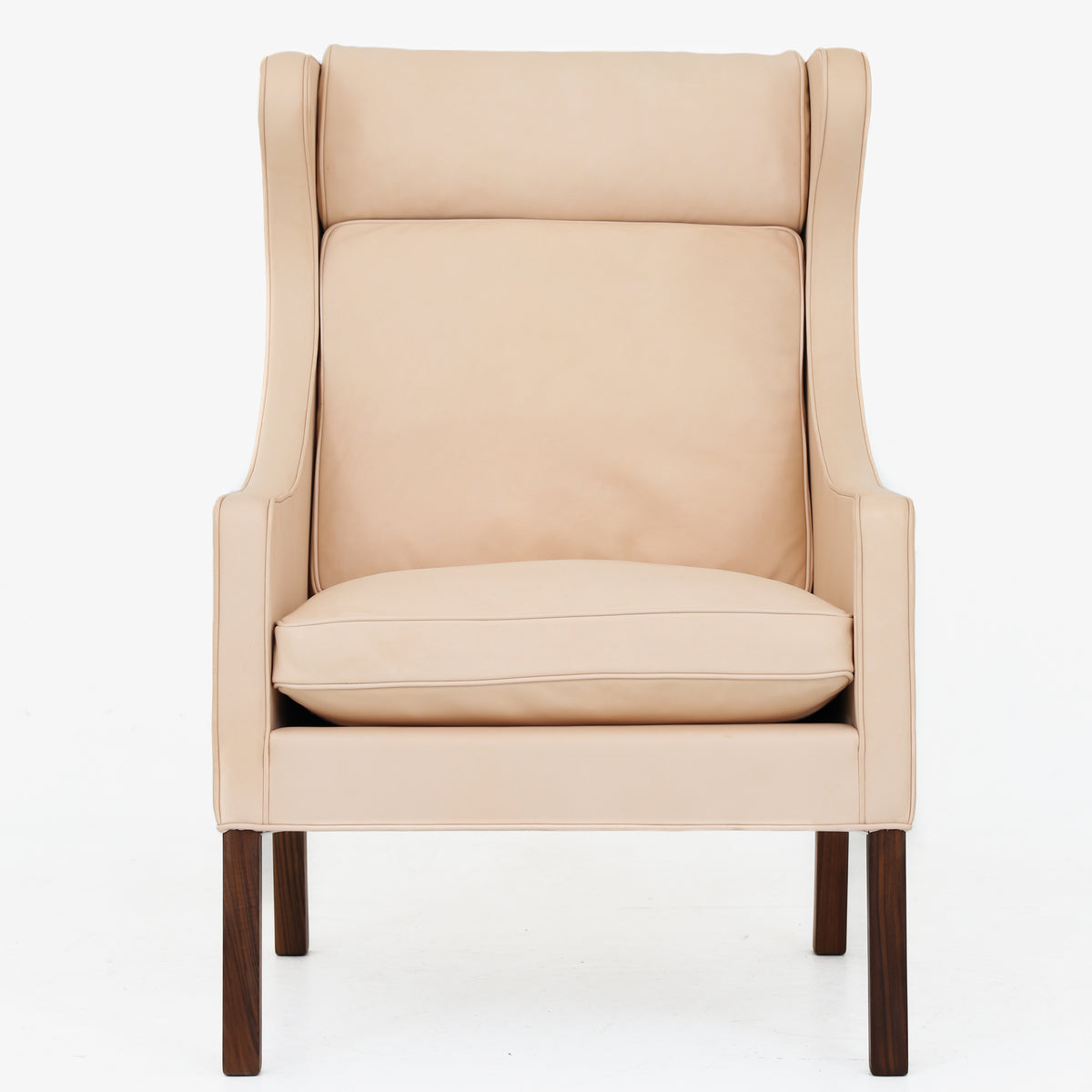 BM 2204 - A pair of Wingback Chairs in natural leather